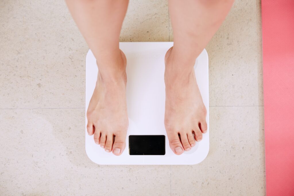 person standing on white digital bathroom scale, coconut blossom nectar, coconut nectar whole foods, coconut flower nectar. organic coconut palm nectar, muhamad_nizar_fariz