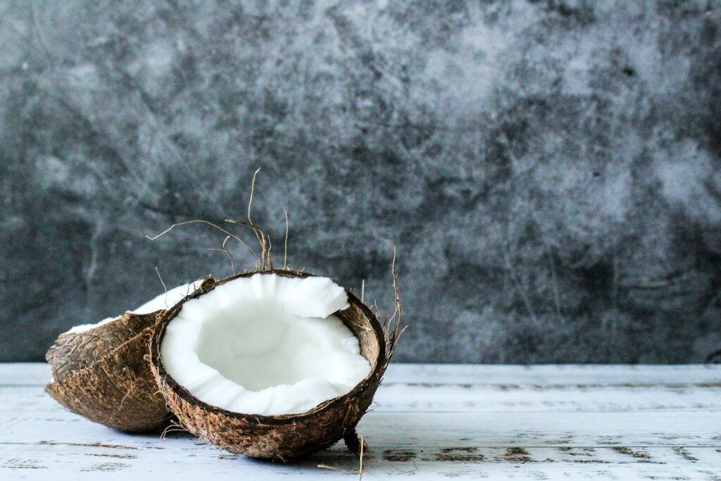 white round ornament on brown wicker basket, organic desiccated coconut, unsweetened desiccated coconut, desiccated coconut powder, fine shredded coconut
