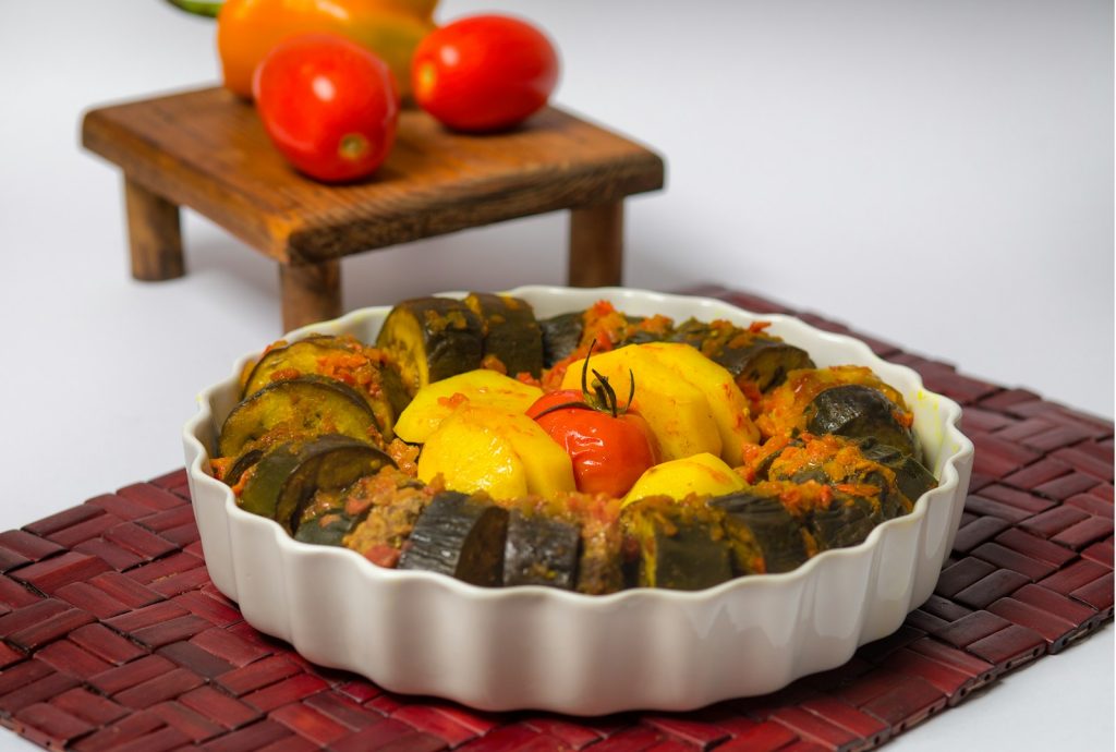 a dish of food sitting on top of a red mat